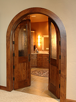 Leading into the master bath, the True Arch pair suggests a luxurious retreat.