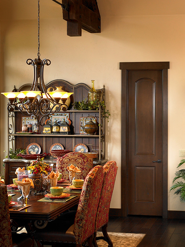A lovely French Country setting featuring a select Alder door with Top Rail Flat Arch, finished in Sun Mountain’s Redcliff Mountain glaze.