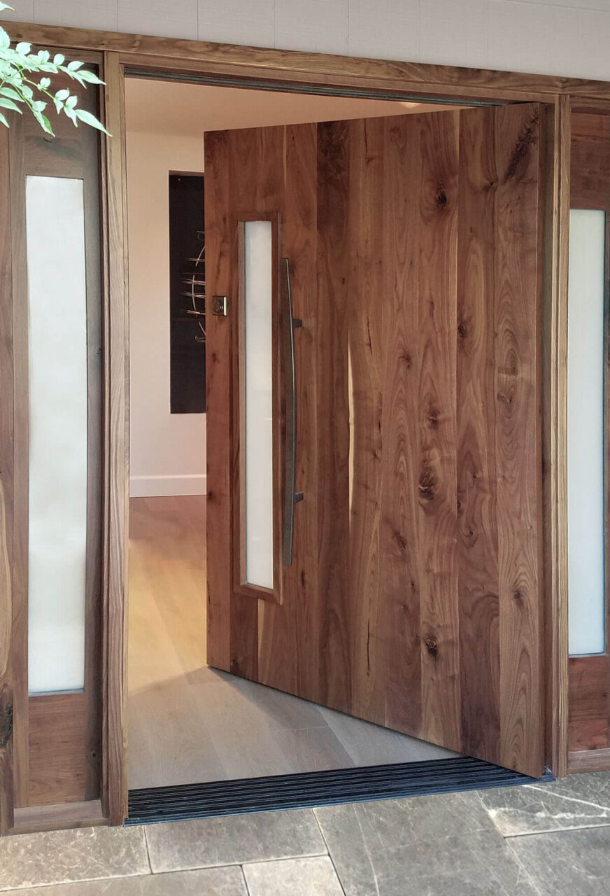 Knotty Walnut Pivot Door finished in Clear Coat