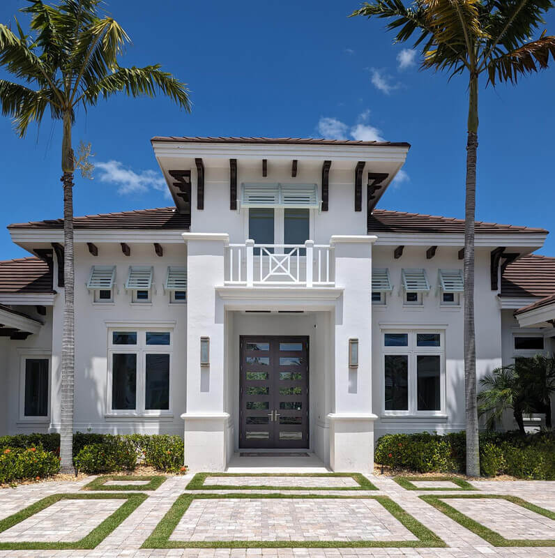 Coastal Contemporary home with 7-lite double door entry