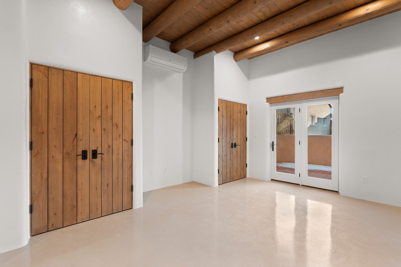 Contemporary Southwestern Flush Vertical Grain Knotty Alder Doors 