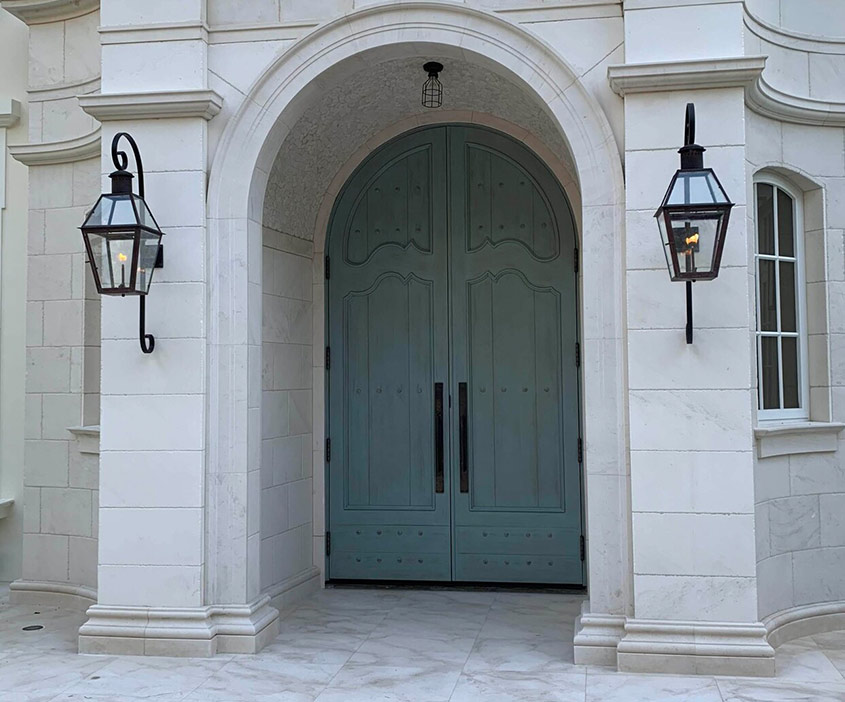 SIGNATURE DOORS - CUSTOM with iron front entrance